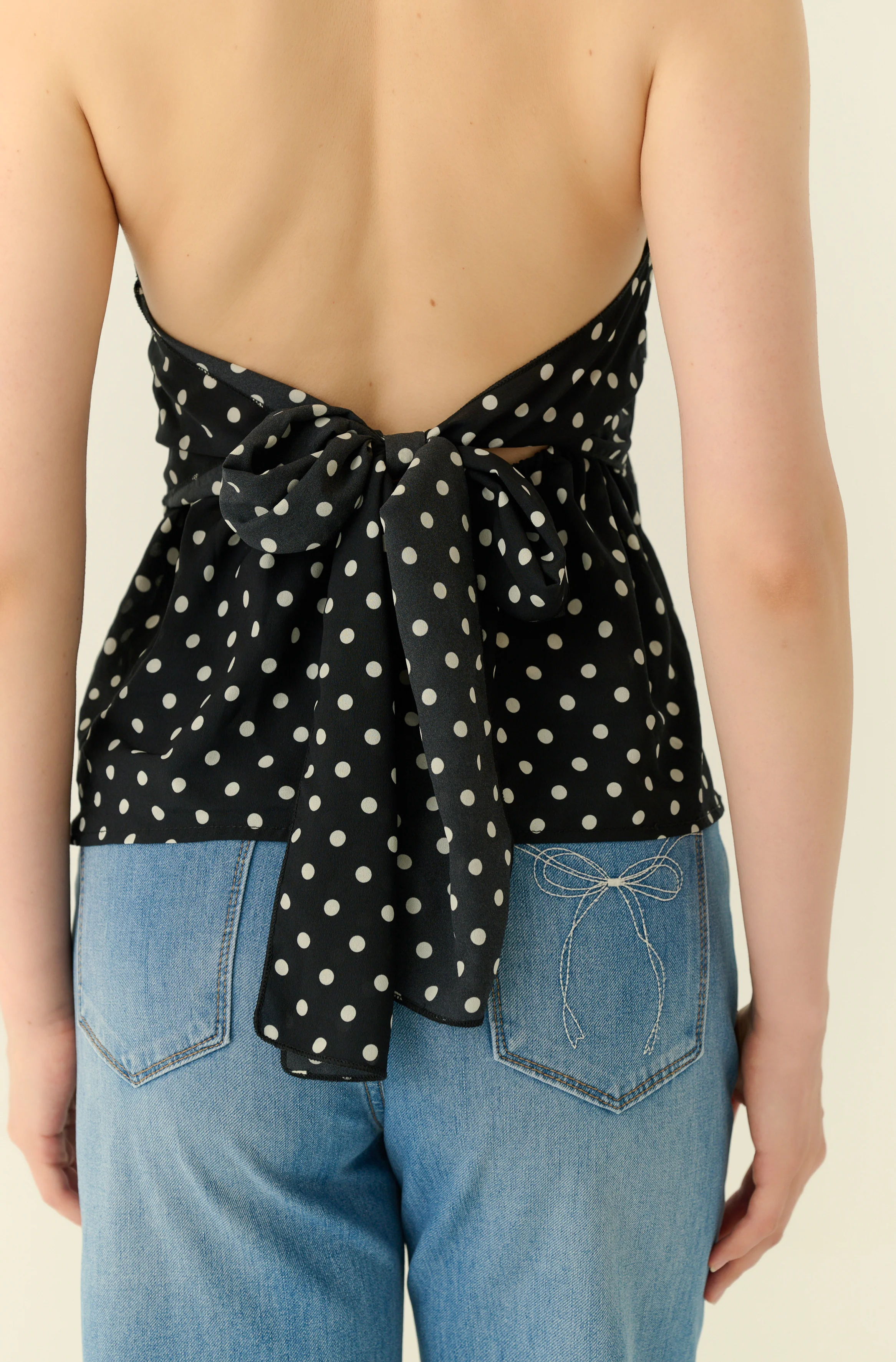 Petite pomme polka dot halter in black